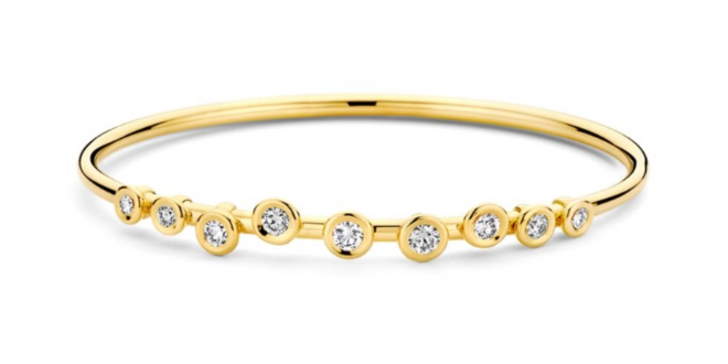 Gold bangle with scattered diamonds. 