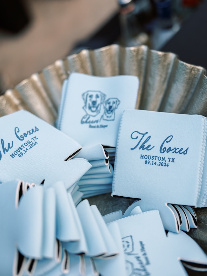 For blue wedding inspiration the bride and groom have blue koozies for their wedding favors. 