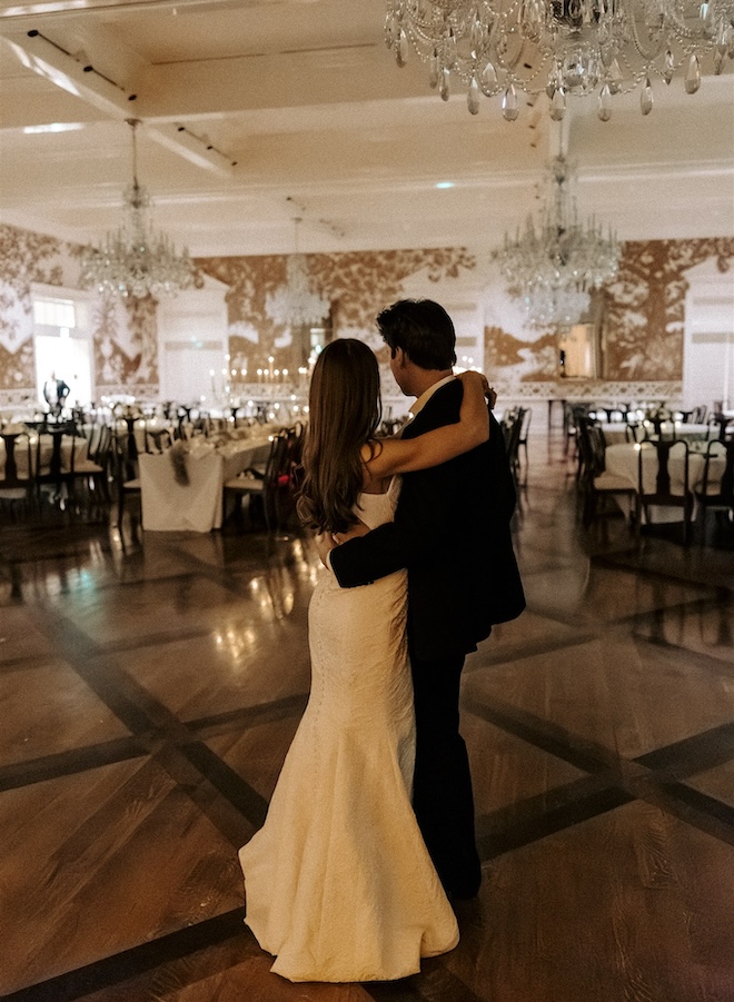 The bride and groom having a private last dance in the ballroom. 