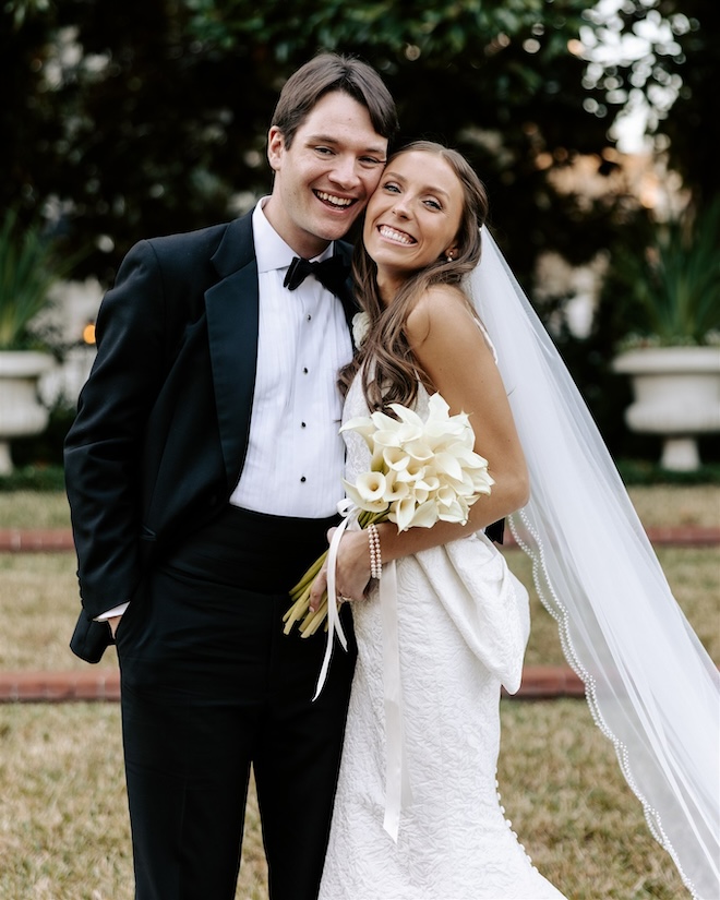The b ride and groom smiling. 