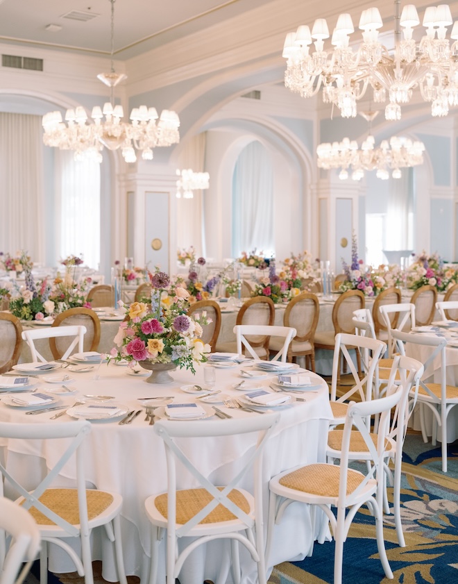 The ballroom at the Grand Galvez has blue walls with white crown molding and trim. 