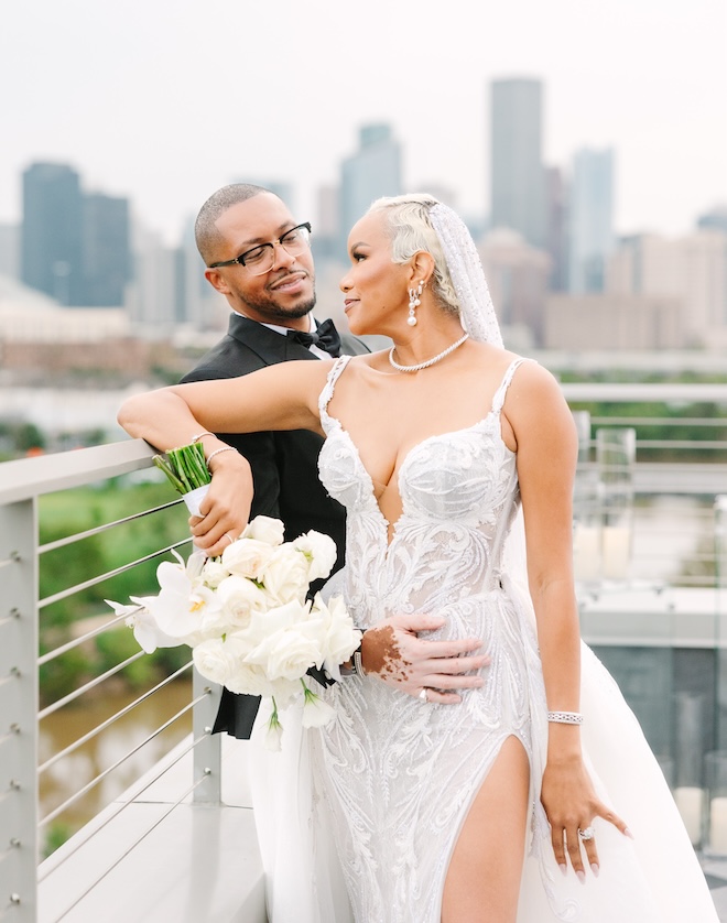 The bride, LeToya Luckett, looking back at the groom with the Houston skyline in the background. 
