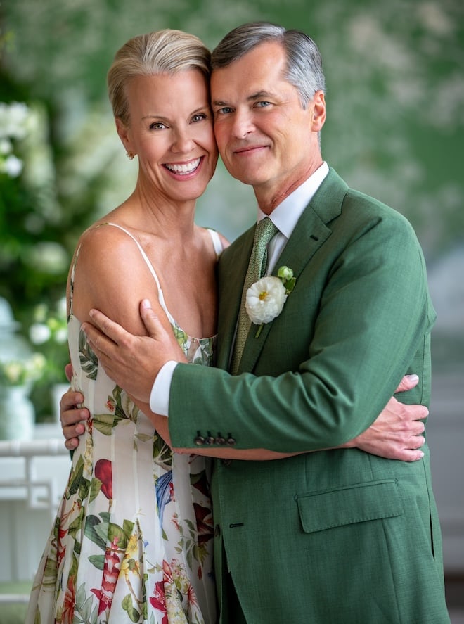 The bride and groom smiling. 