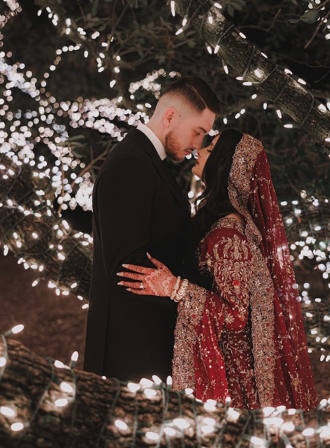 The bride and groom under the oak tree at The Houstonian Hotel, Club & Spa. 