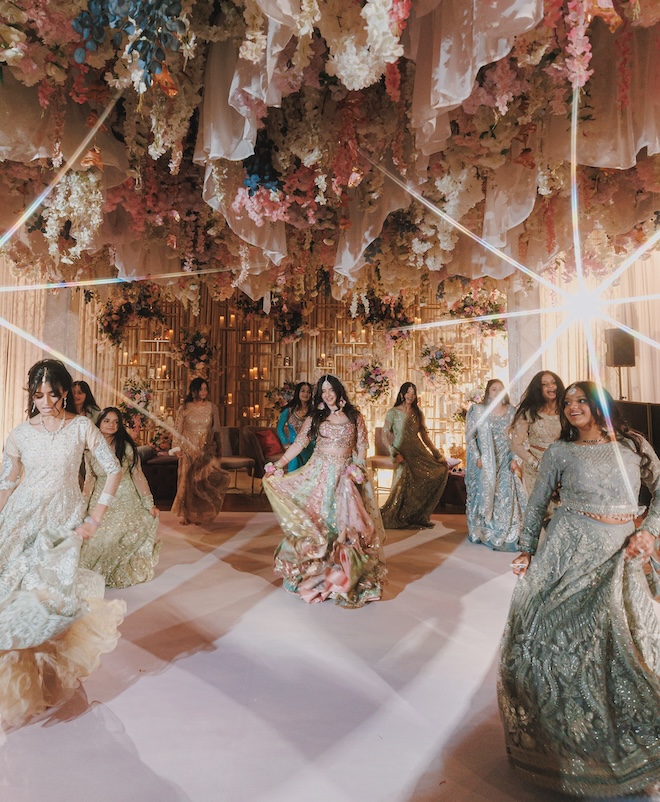 The bride and other guests dancing. 