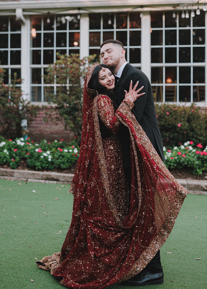 The groom emotionally hugging the bride after the first look. 