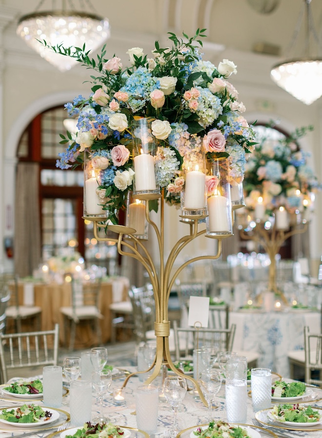 Blue hydrangeas are arranged in a floral arrangement for the Houston wedding reception.  