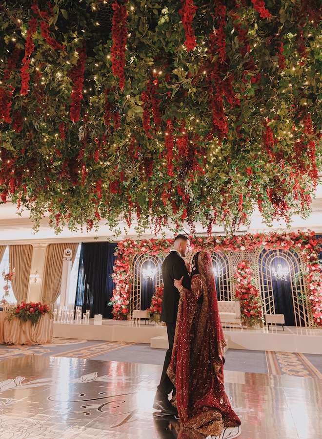 Red roses and floral installations decorate the ballroom at The Houstonian Hotel, Club and Spa.