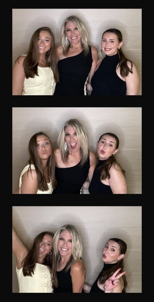 Weddings in Houston team members posing in the photo booth. 