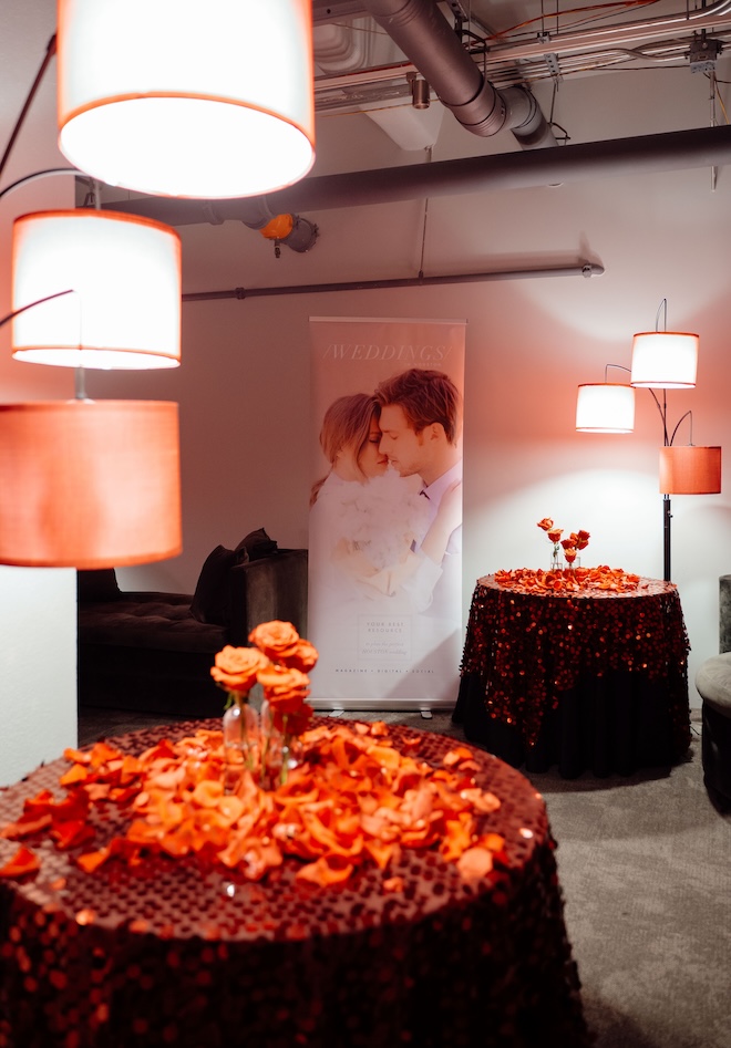 Another room in the Vault featuring Weddings in Houston signage and red sequined tablecloths. 