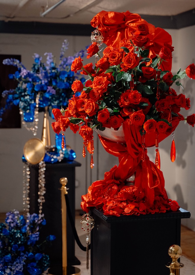 Red rose floral installation and a blue floral installation. 