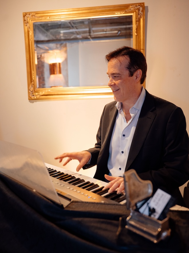 Scott Graham playing piano.