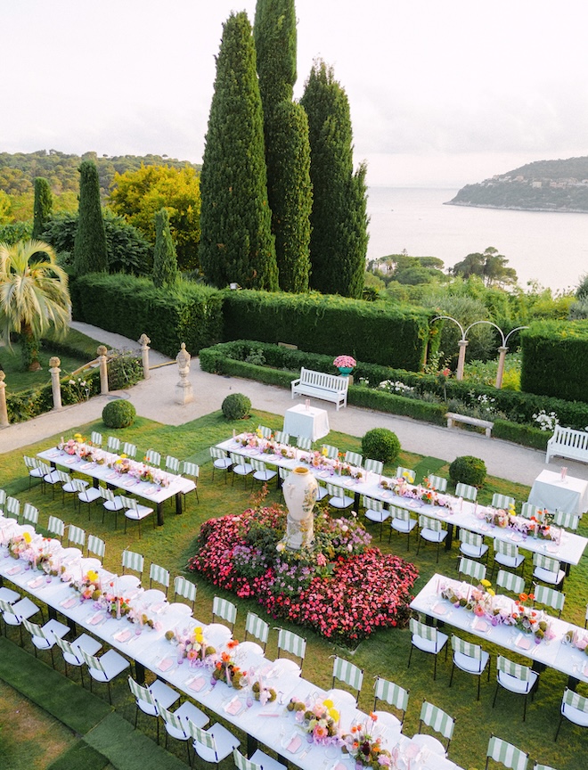 Family style tables are decorated in yellow and orange flowers. 