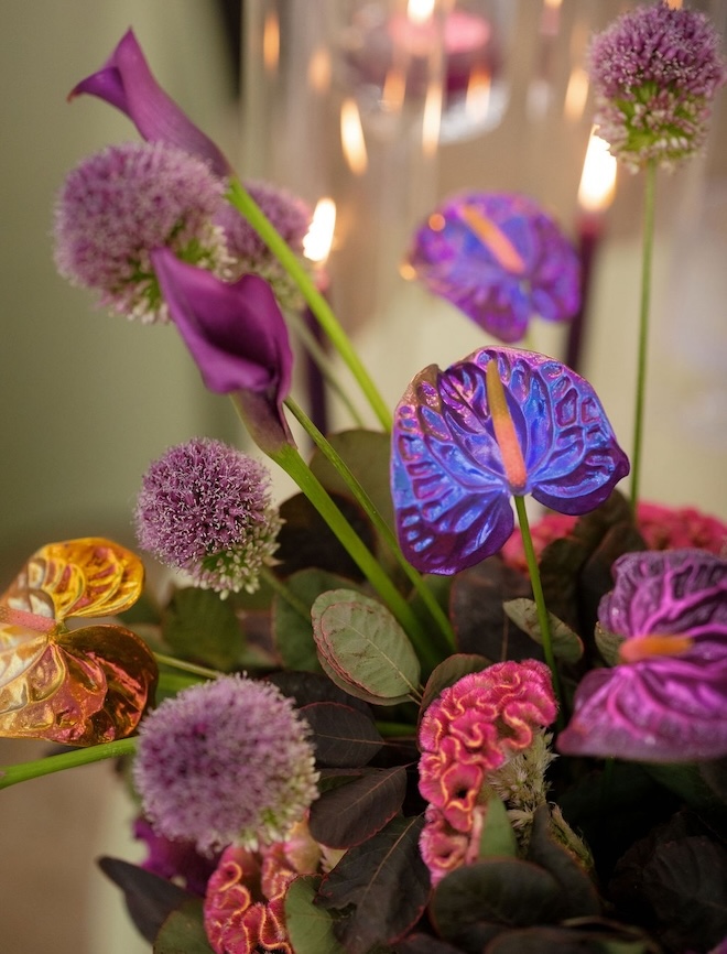 Bright purple, blue and yellow florals by Fashionable Florist. 