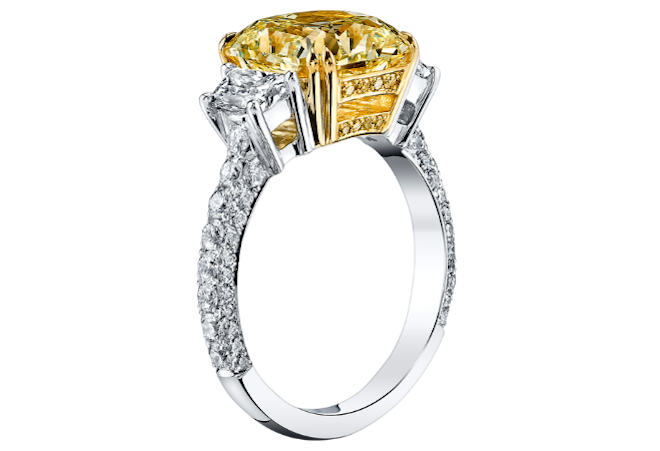 A three stone yellow diamond is a statement stone engagement ring available at Deutsch Fine Jewelry.