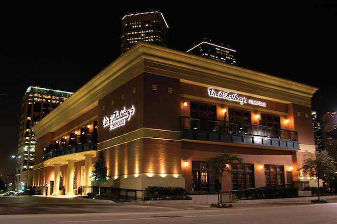 Exterior of one of top Houston restaurant venues with dim lighting all over the building in the middle of Houston.
