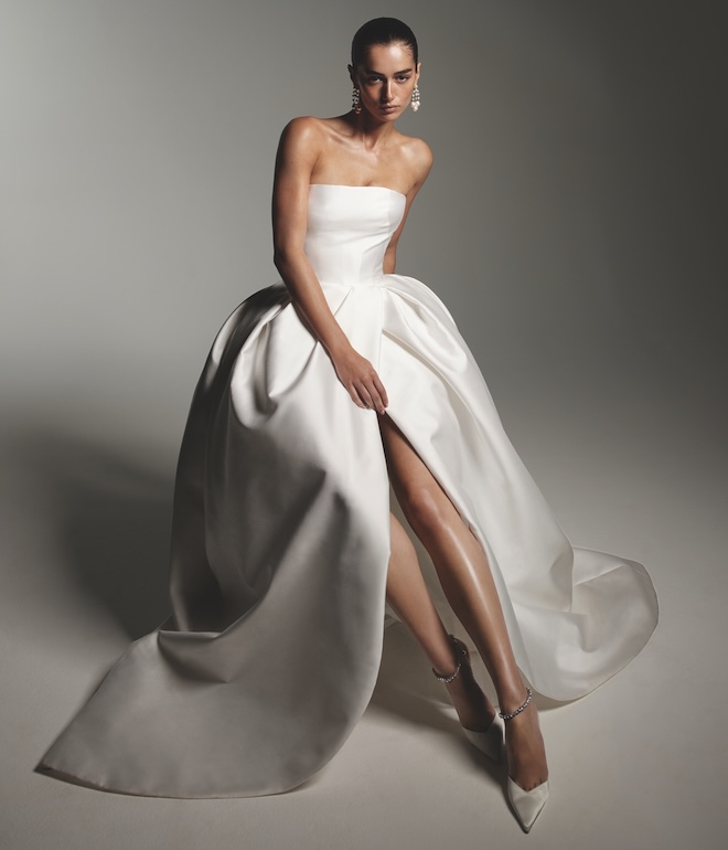 The model wears a Monique Lhuillier gown. 