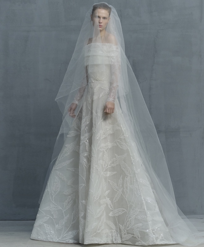 The model wears a gown by Elie Saab with lace detailing.