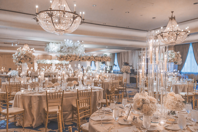 Reception table details with cream and gold hues and florals for glamorous gold wedding at Houstonian.