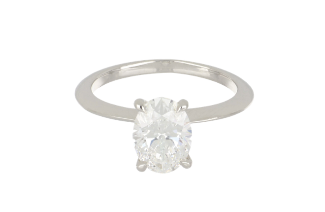 Oval cut diamond solitaire engagement ring by Tenenbaum Jewelers.