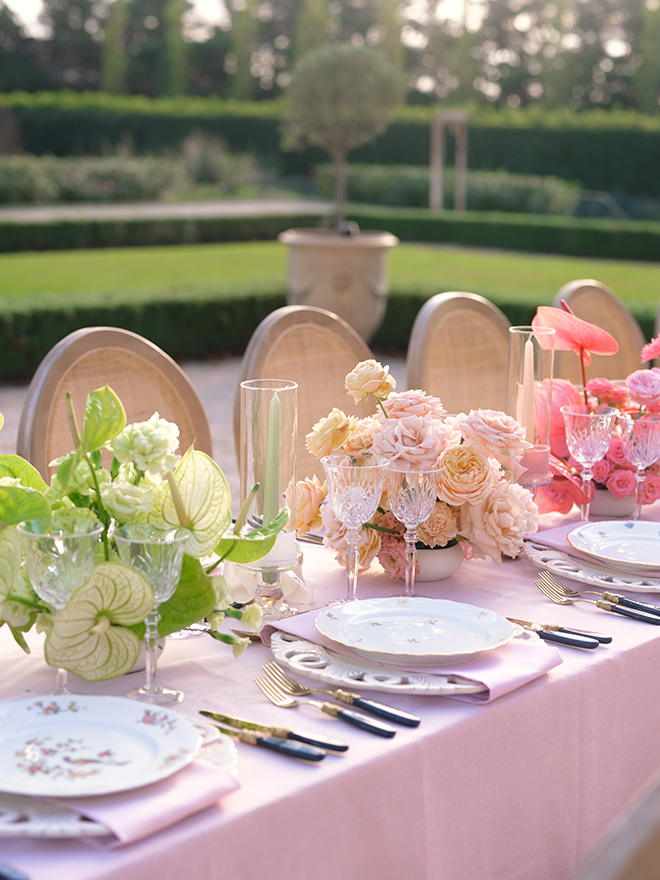 Pink and green flowers decorate the reception table. 