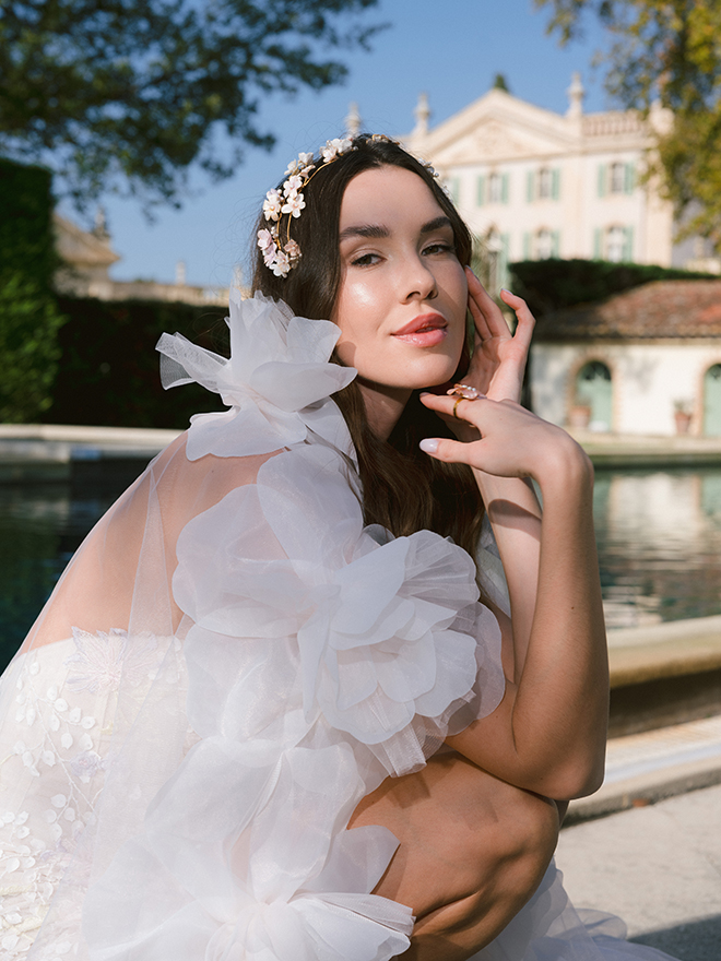 The bride poses next to the pool at Château de Tourreau. 