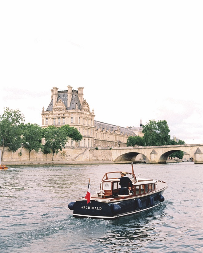 A boat floats down the Seine in Paris. 