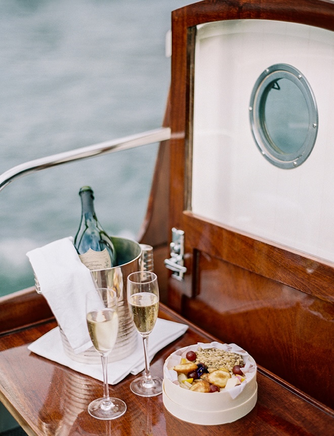 Champagne and treats are served on the boat. 