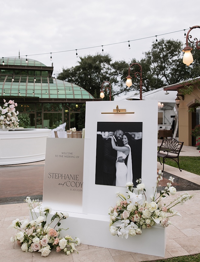 A picture of the couple is displayed at cocktail hour. 