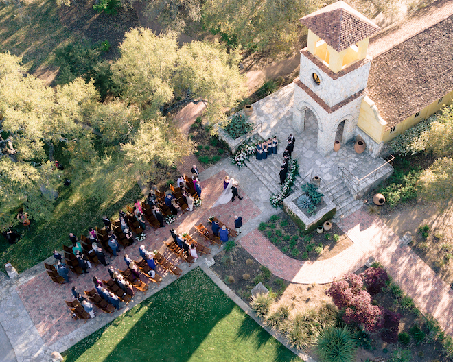 Aerial view of small ceremony and bride walking up to the altar in an intimate hill country wedding.