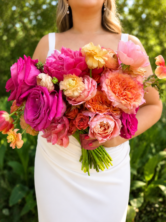 Pink, coral, yellow colorful large bridal bouquet for summer wedding florals.