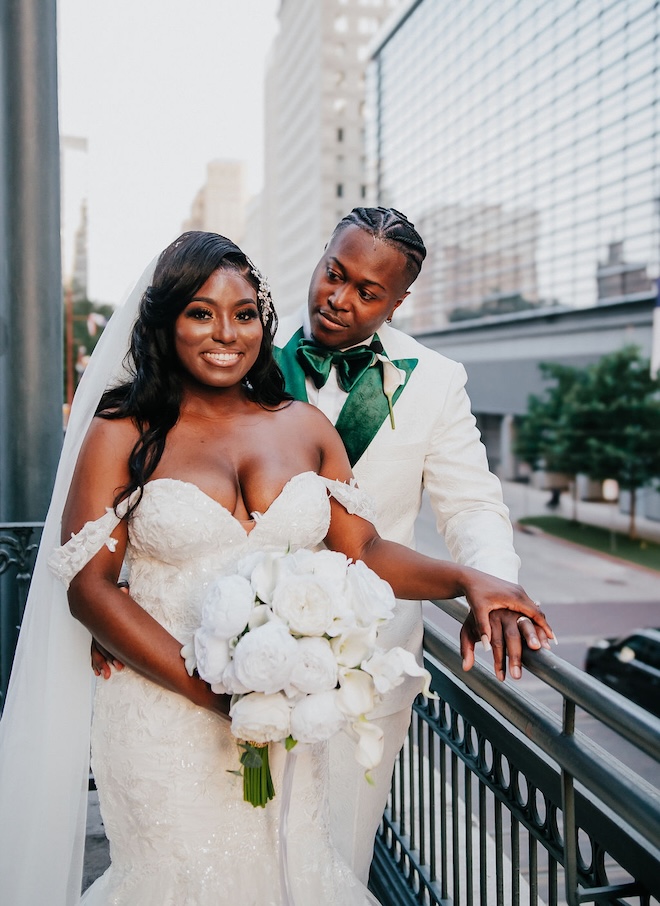 The couple pose on the terrace of the Crystal Ballroom at The Rice overlooking downtown Houston. 