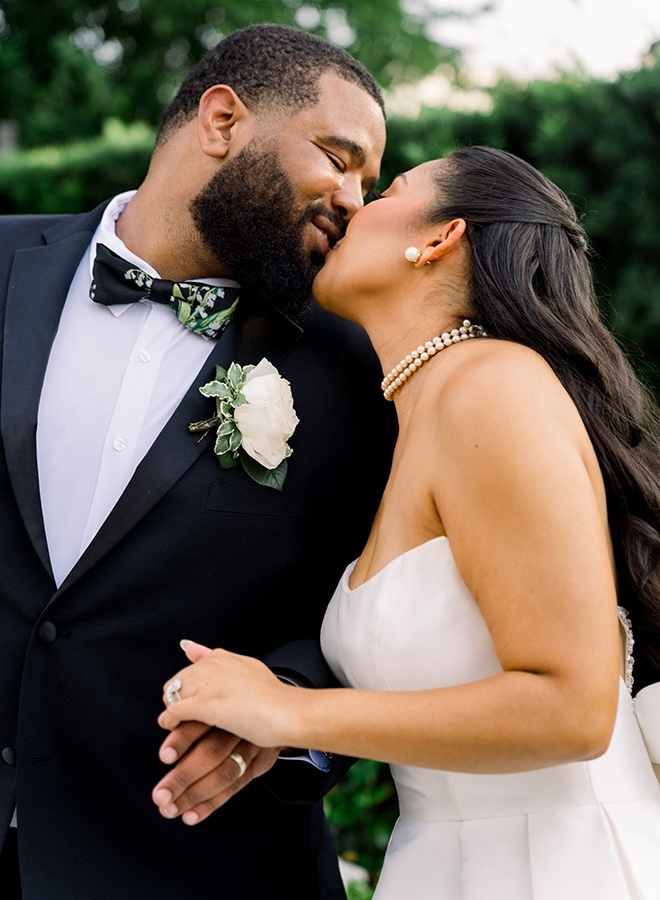 The bride and groom share a kiss. 