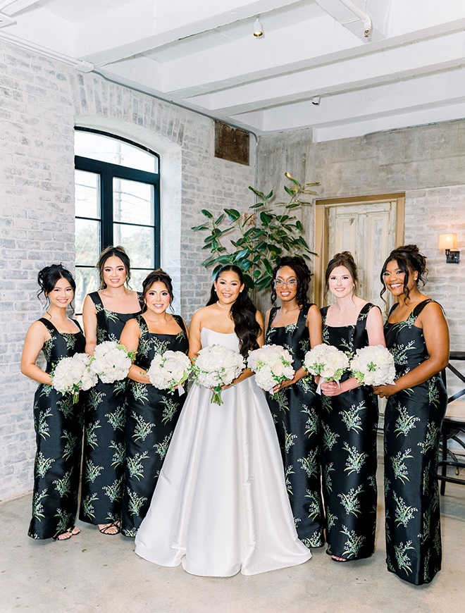 The bride stands with her bridesmaids in Houston. 