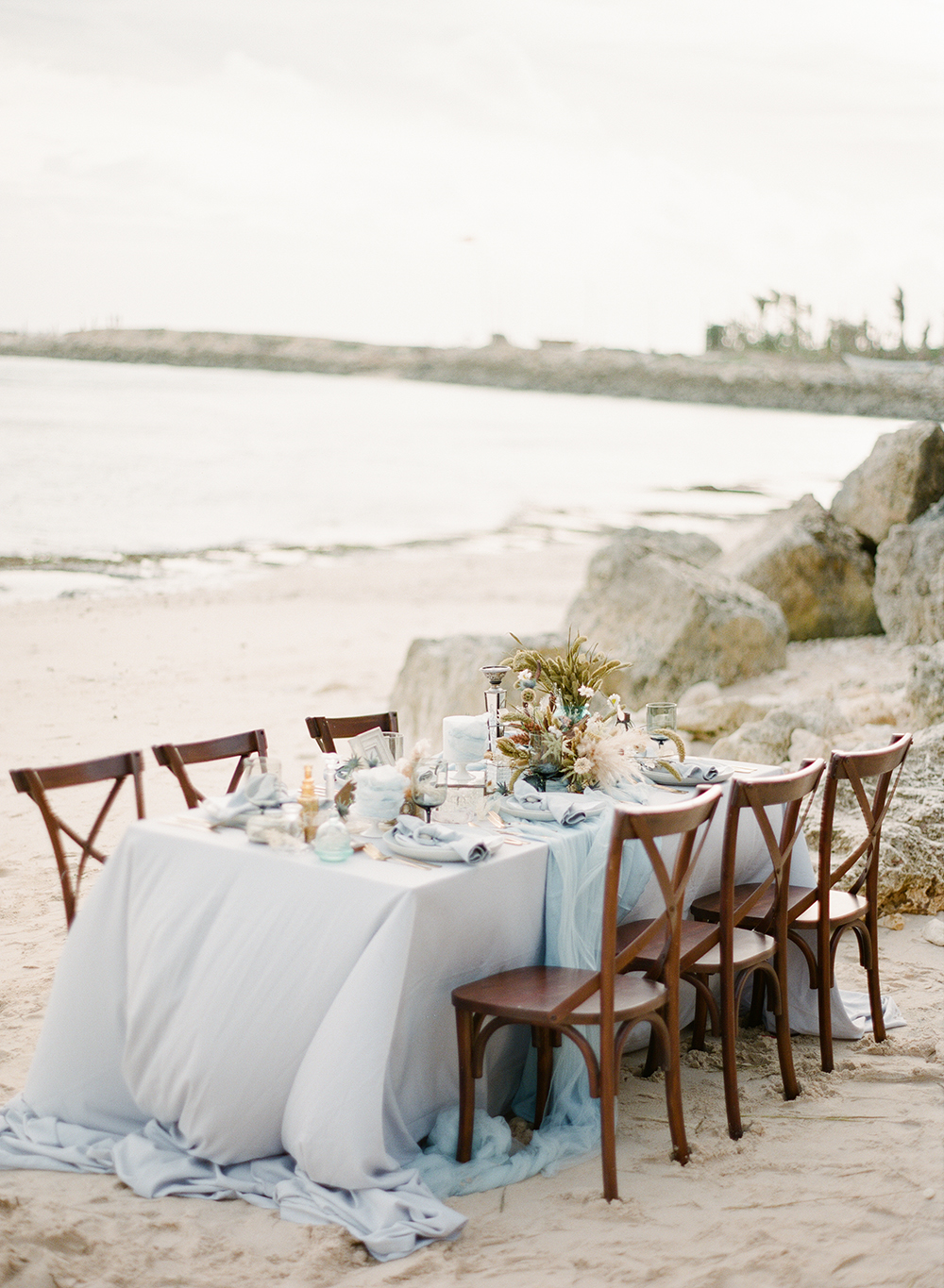 blue boho beach wedding decor - reception table setting