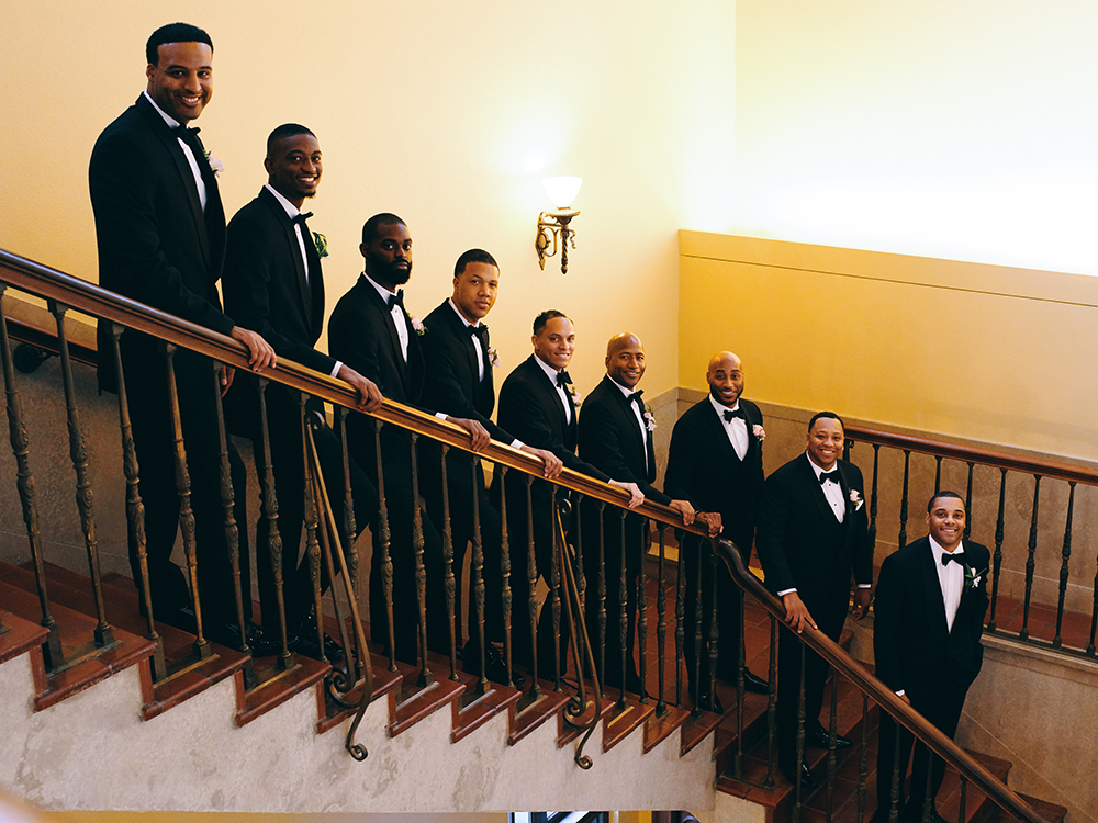 groomsmen photo on the stairs - black tuxedos - unique spaces for wedding party photos