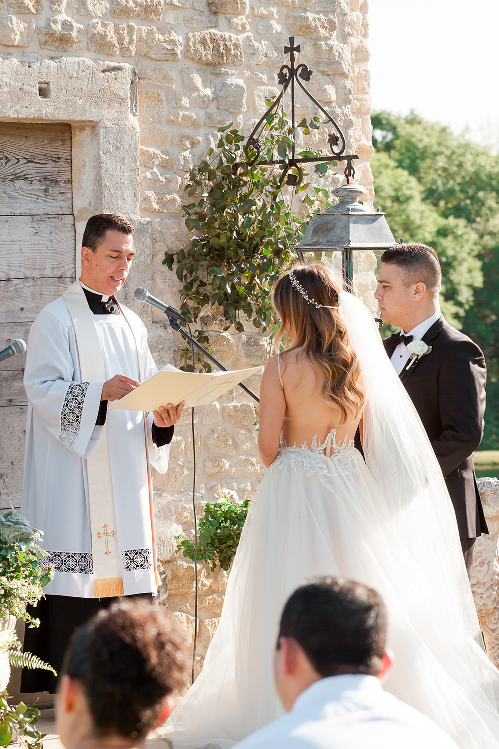 gorgeous wedding dress and veil at ceremony