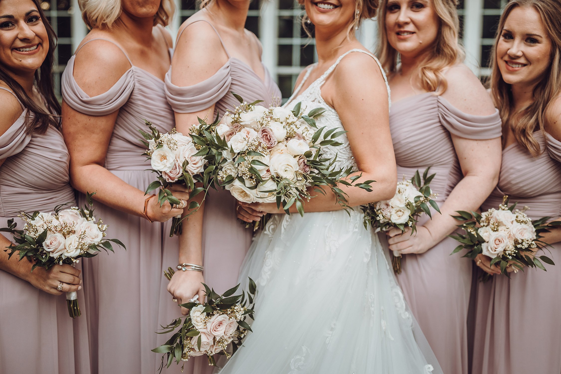 bridesmaids bouquets and mauve dresses