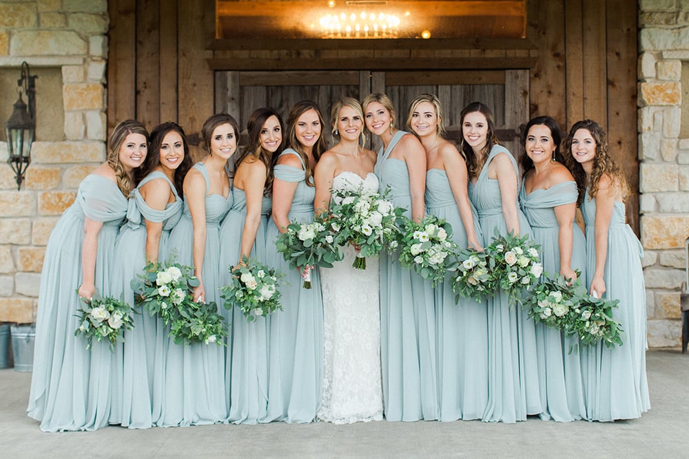 baby blue bridesmaids dresses with white and green bouquets