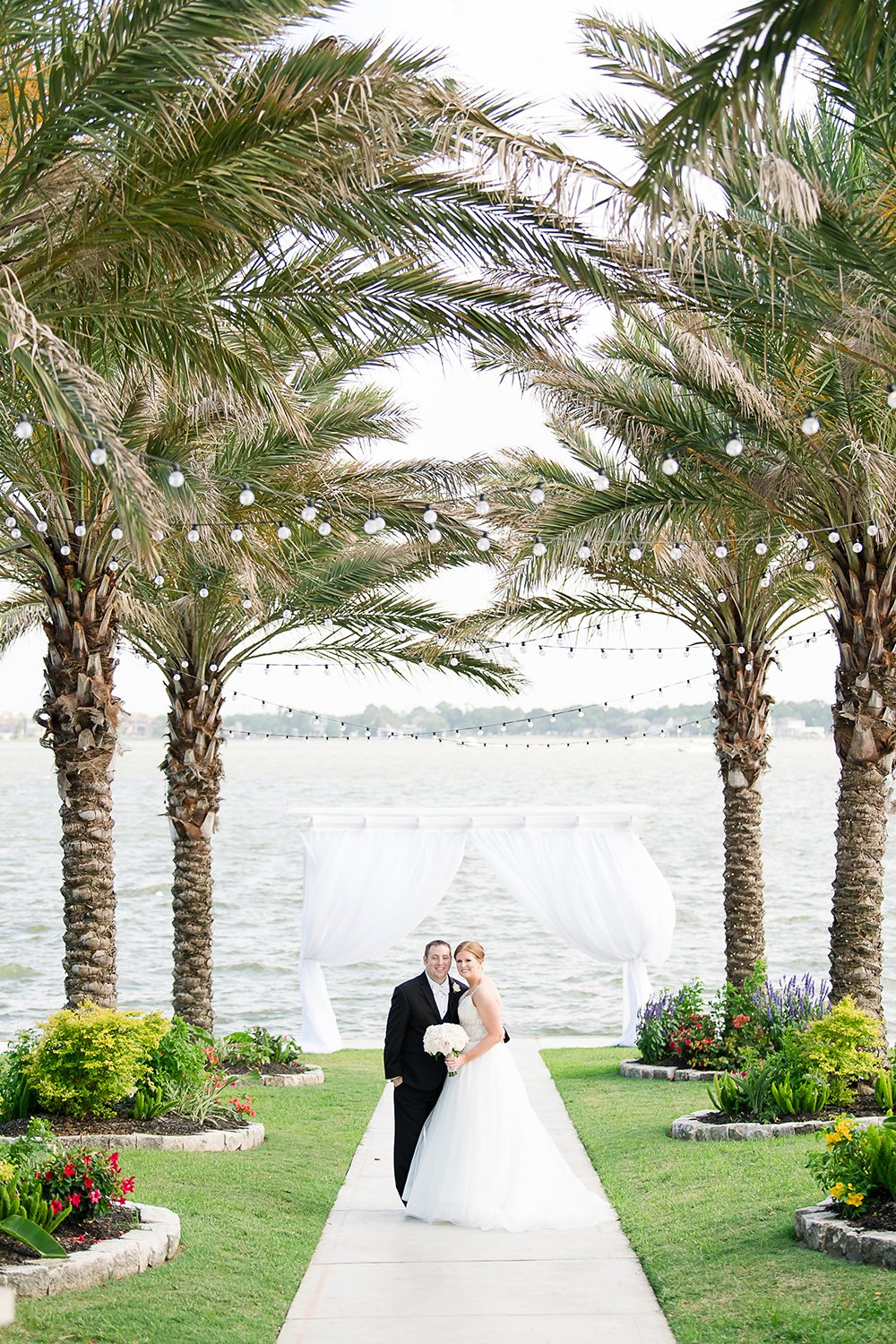 lakeside wedding ceremony with beautiful string lights