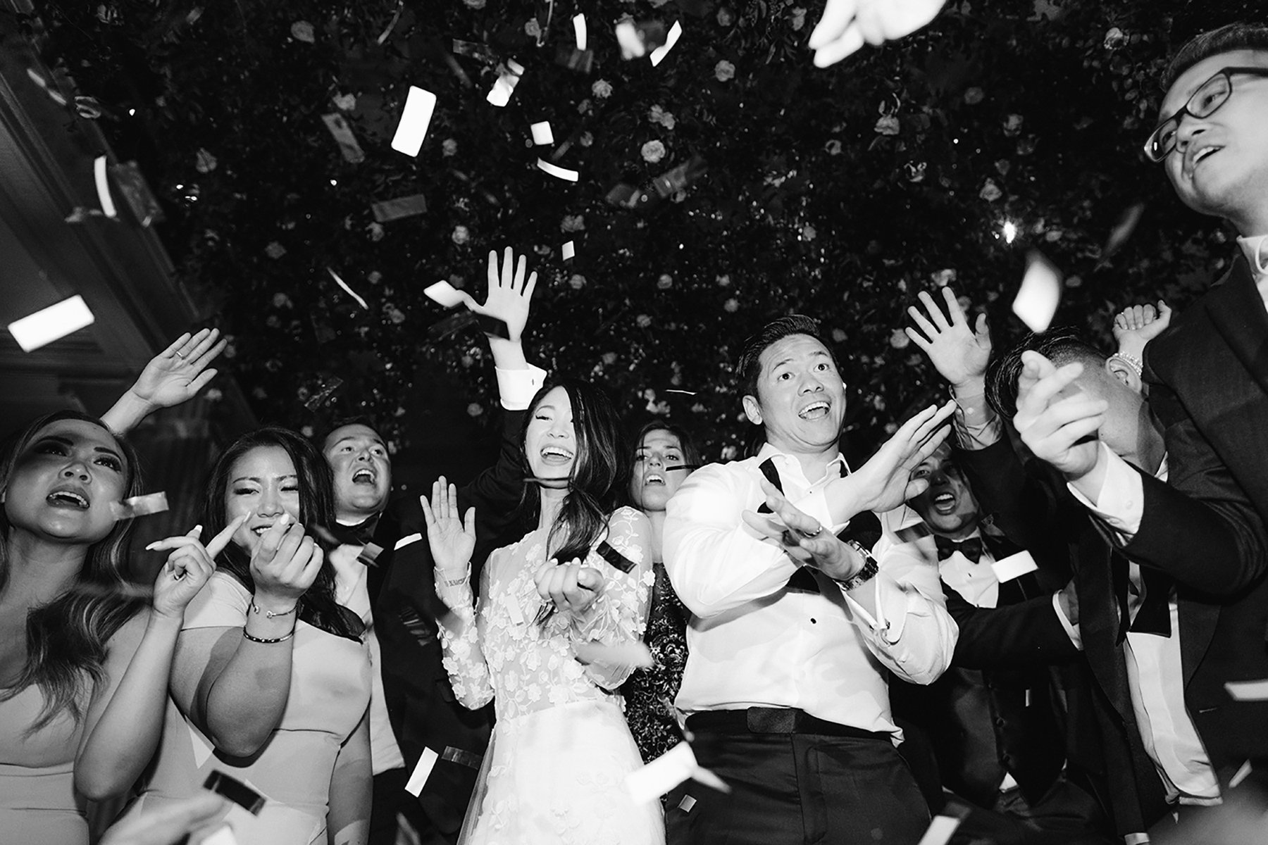 couple dancing in crowd with confetti