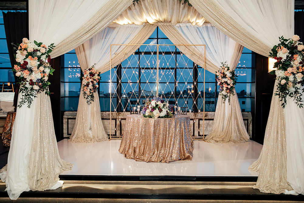 indoor wedding ceremony decor - white, gold