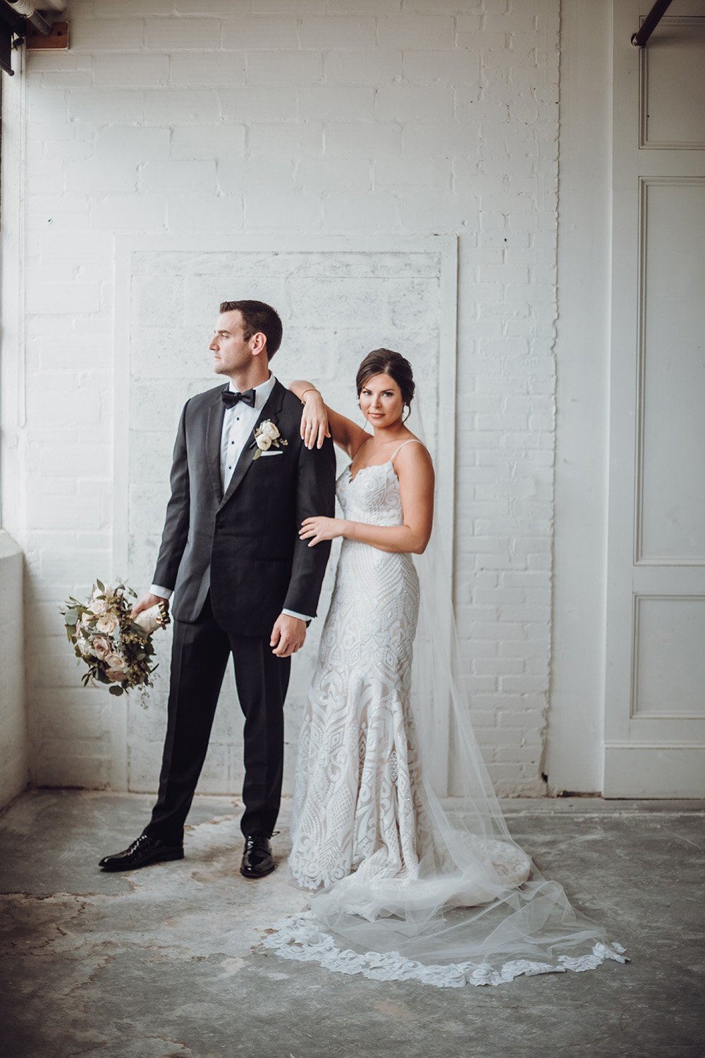 wedding photography of the couple, bouquet in hand