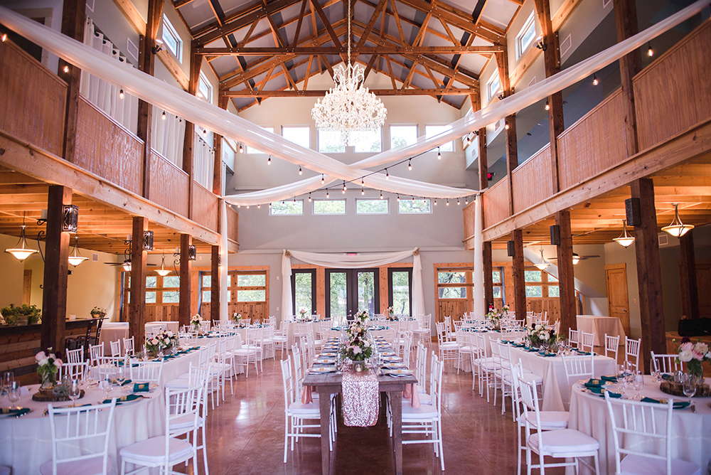 barn with chandelier - two story wedding venue